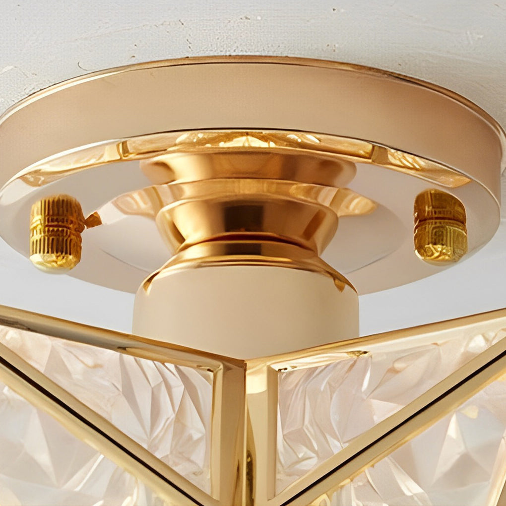 Ceiling view of a gold-finished glass Moravian star pendant light with intricate glasswork design.