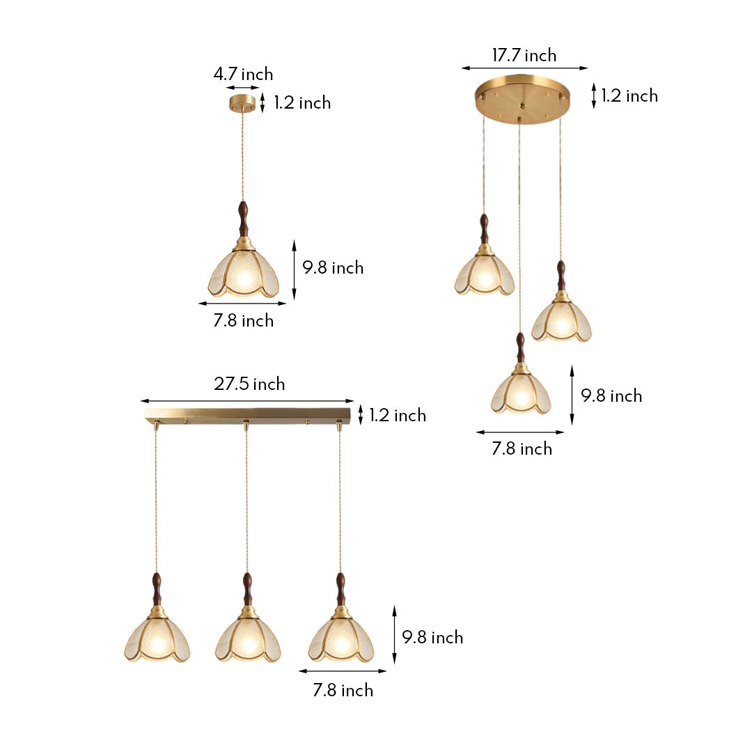 Elegant glass pendant lighting with gold frame and floral-inspired shades, hanging in a modern cluster.