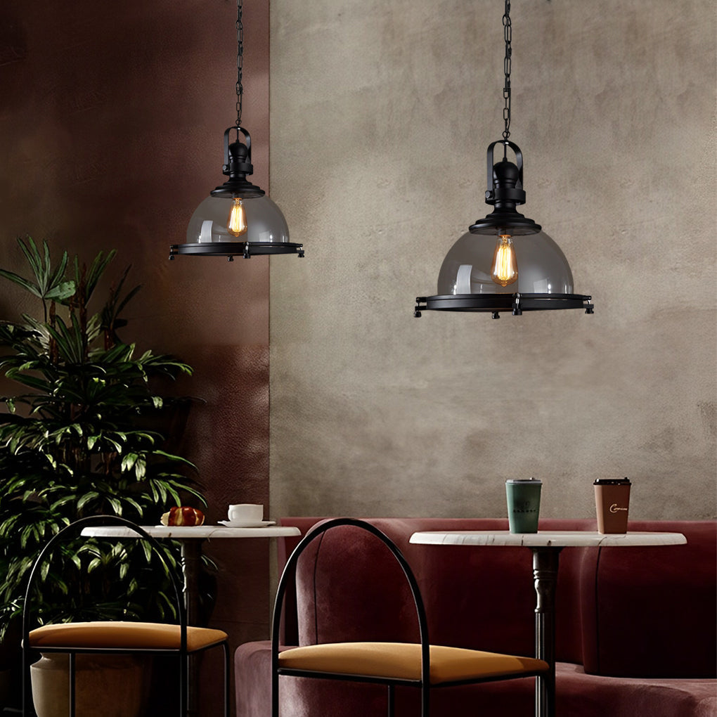 Glass pendant lights kitchen arranged above booth seating adding industrial character to the space.