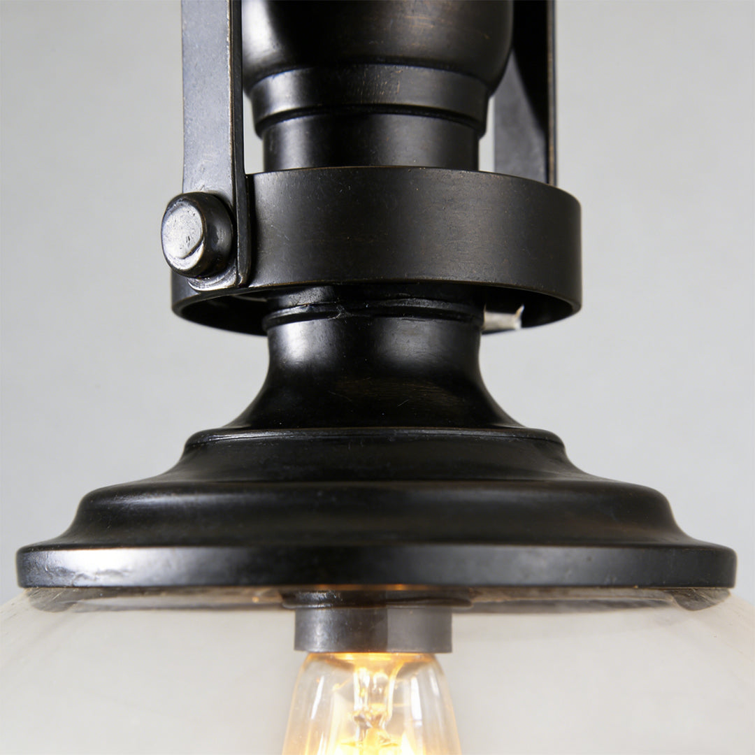Glass pendant lights kitchen detail showing clear glass dome with exposed filament bulb.
