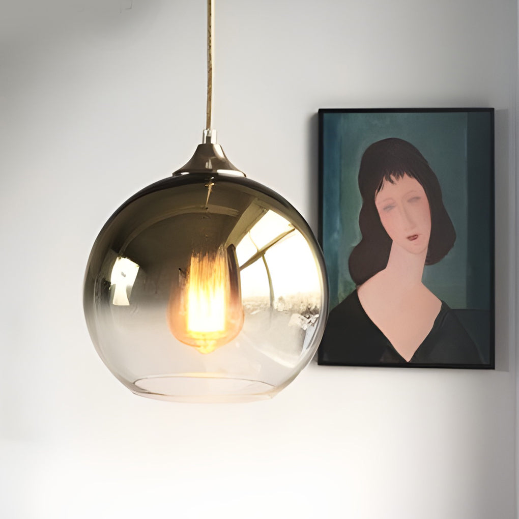 Glass round pendant light serving as an accent light in a bedroom.