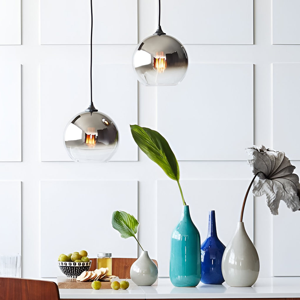 Glass round pendant light styled in a minimalist interior setting.
