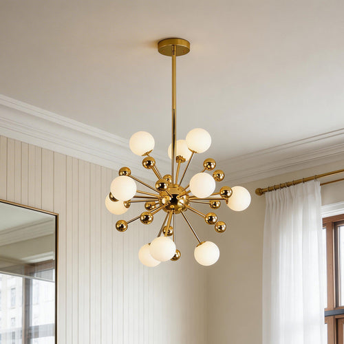 Mid-century modern gold 12 light sputnik chandelier featuring frosted white glass globes in a contemporary room.