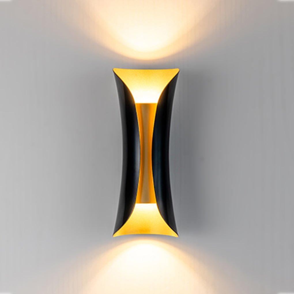 Gold and black indoor up down wall lights with modern sculptural shape.