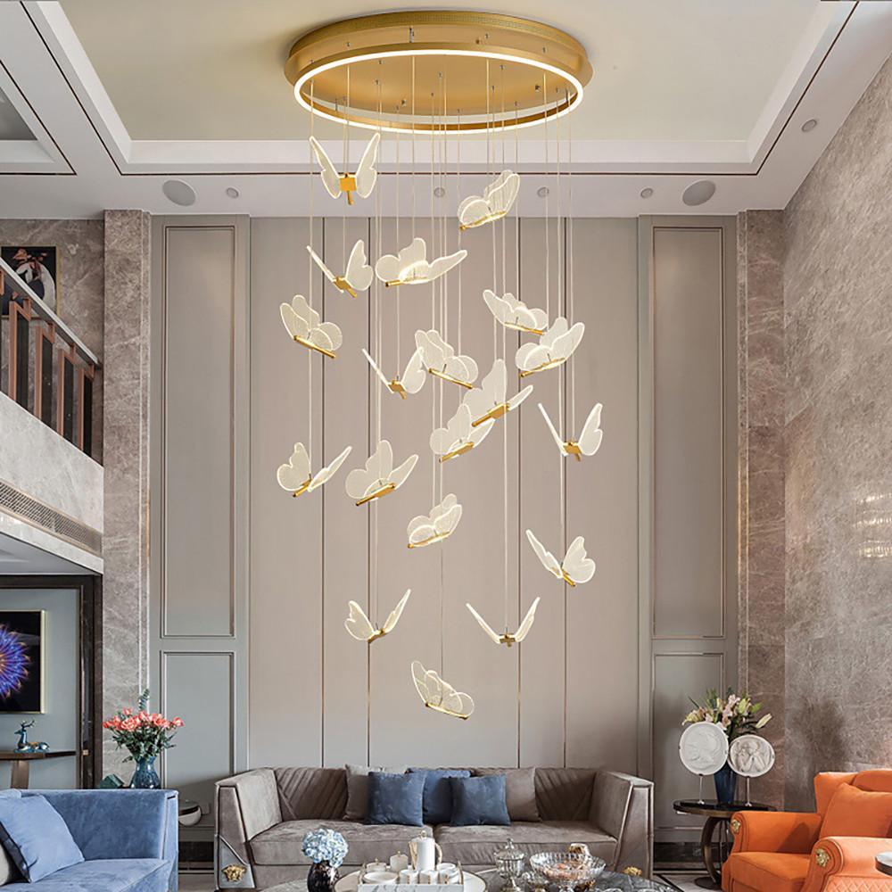 Gold butterfly chandelier creating a dramatic focal point in a contemporary interior.