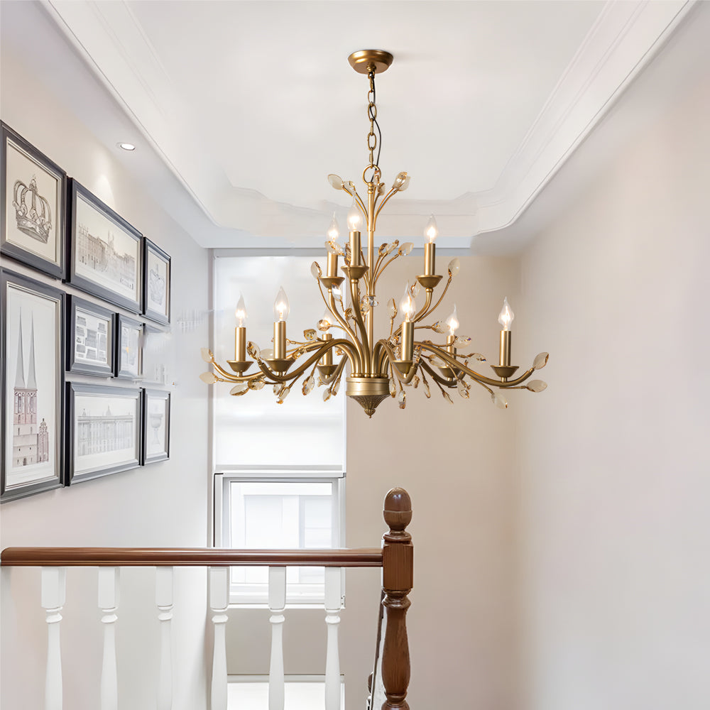 Gold candlestick chandelier with a traditional design, enhancing a cozy dining area.