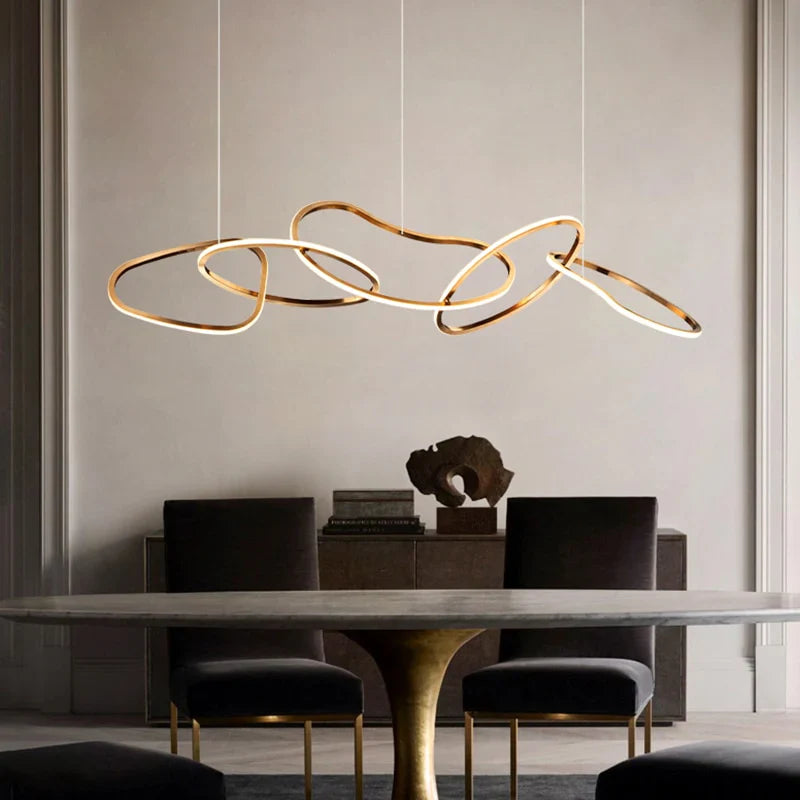 Gold circle chandelier providing ambient lighting in a contemporary interior.