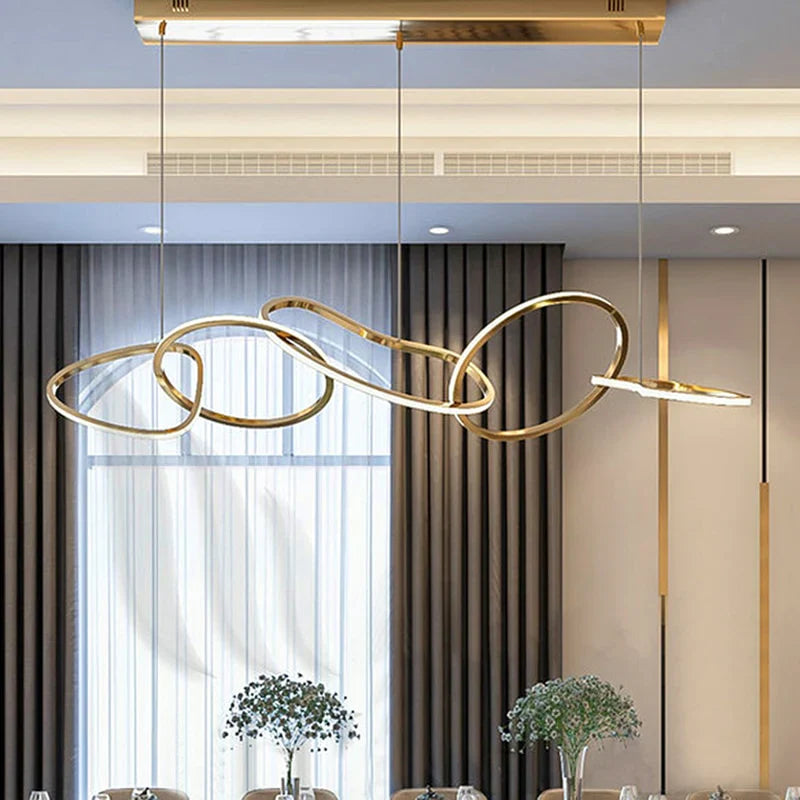 Gold circle chandelier with a close-up of its elegant circular loops.
