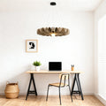Unique gold cloth chandelier lighting a modern minimalist home office desk setup