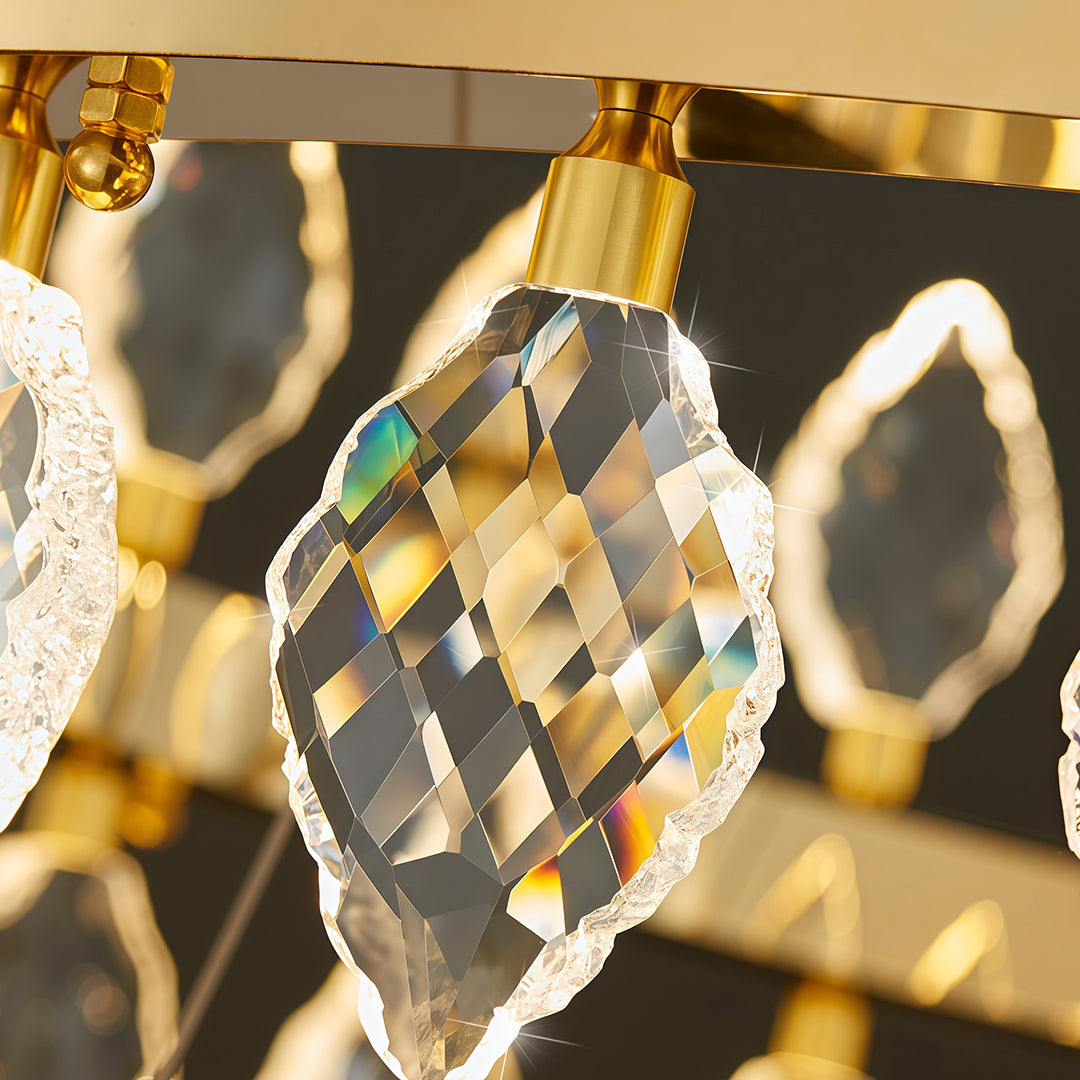 Detailed view of gold frame and crystal elements on crystorama chandeliers.