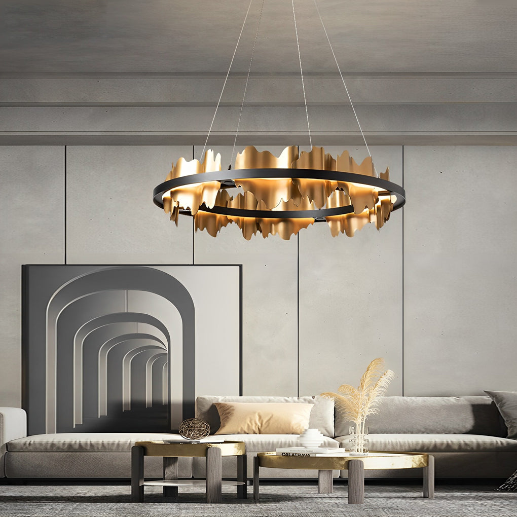 Gold leaf chandelier with a circular design, installed in a modern dining room.