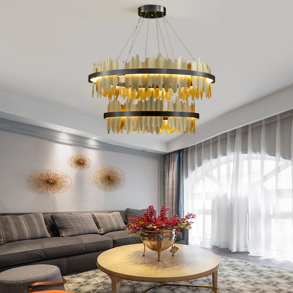Gold leaf chandelier with a close-up of its gold leaf and black metal frame.