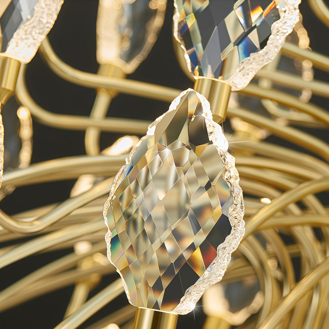 This gold led chandelier features sculptural arms and sparkling crystal buds, creating a refined statement light with energy-efficient performance.