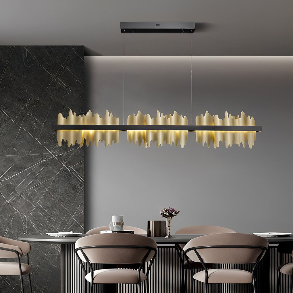 Gold linear pendant light with a black and gold finish, enhancing a stylish dining room.