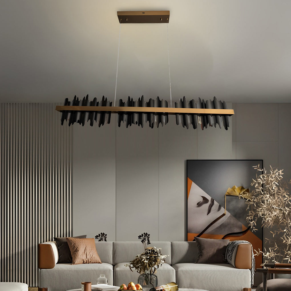 Gold linear pendant light with a close-up of its gold leaf and black metal frame.