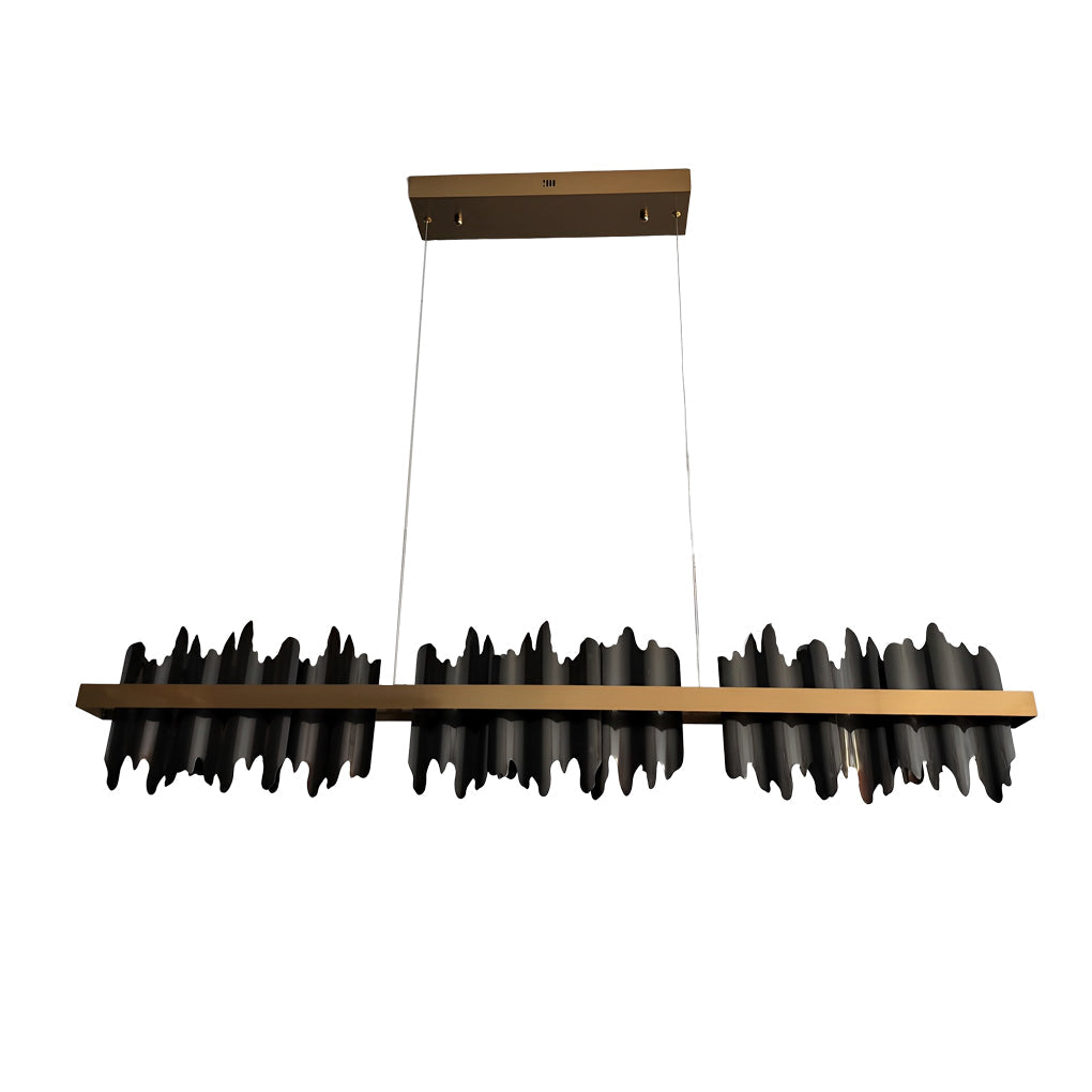 Gold linear pendant light with a modern design, hanging above a kitchen counter.