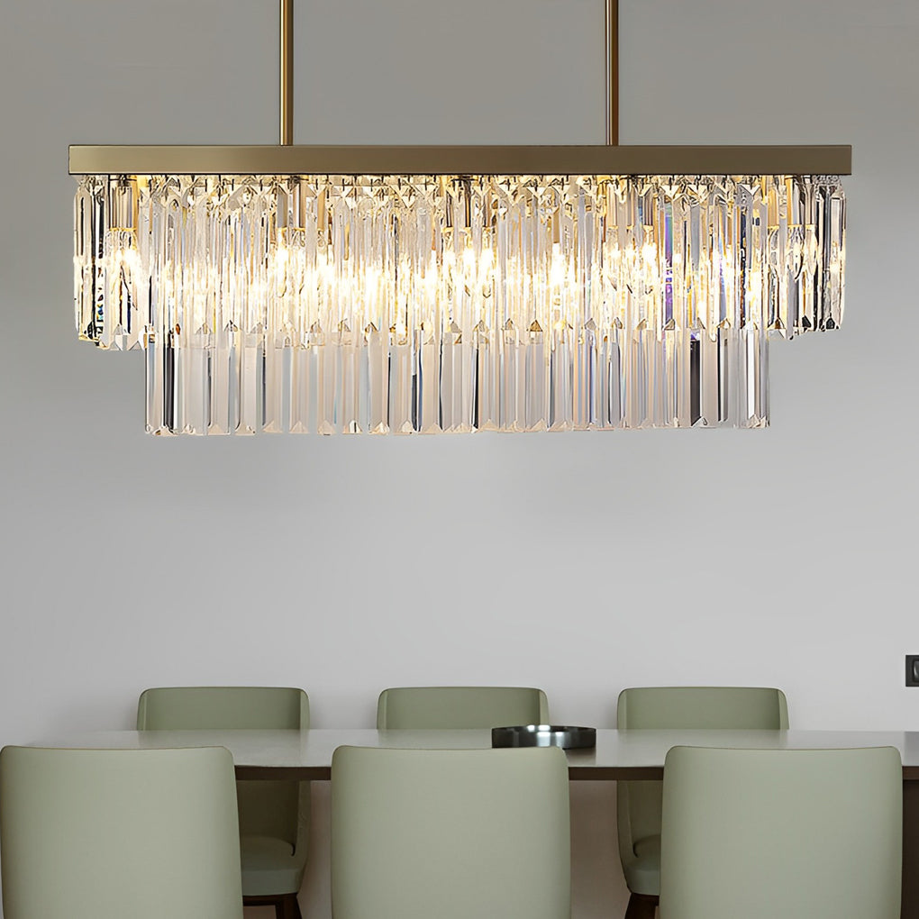 Gold rectangular chandelier providing ambient lighting in a modern dining room.