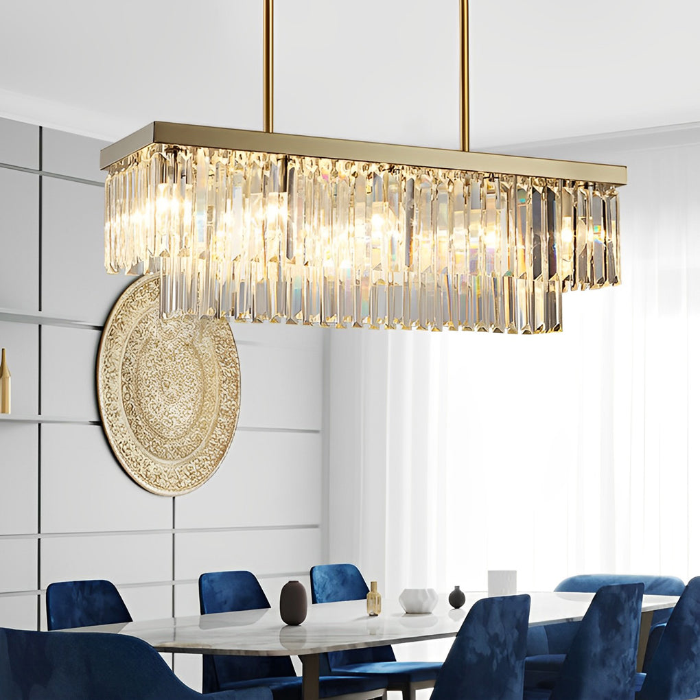 Gold rectangular chandelier with a close-up of its crystal droplets and gold frame.