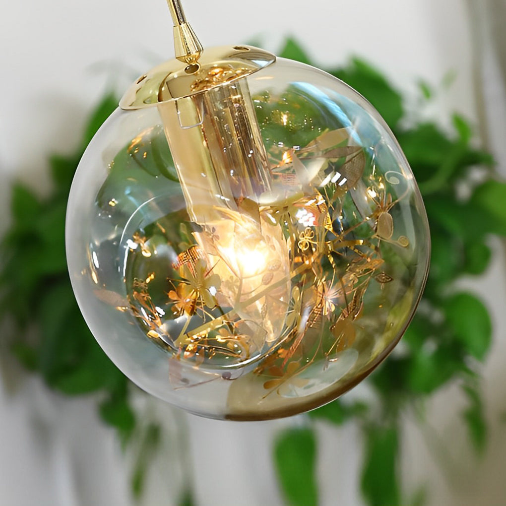 Gold staircase chandelier with a close-up of its detailed crystal and gold structure.