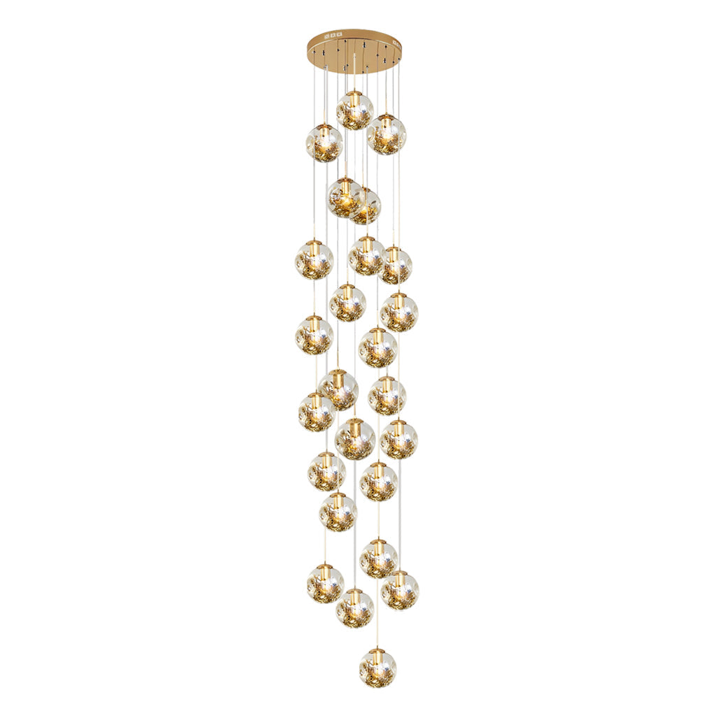 Gold staircase chandelier with a luxurious design, enhancing a grand staircase.