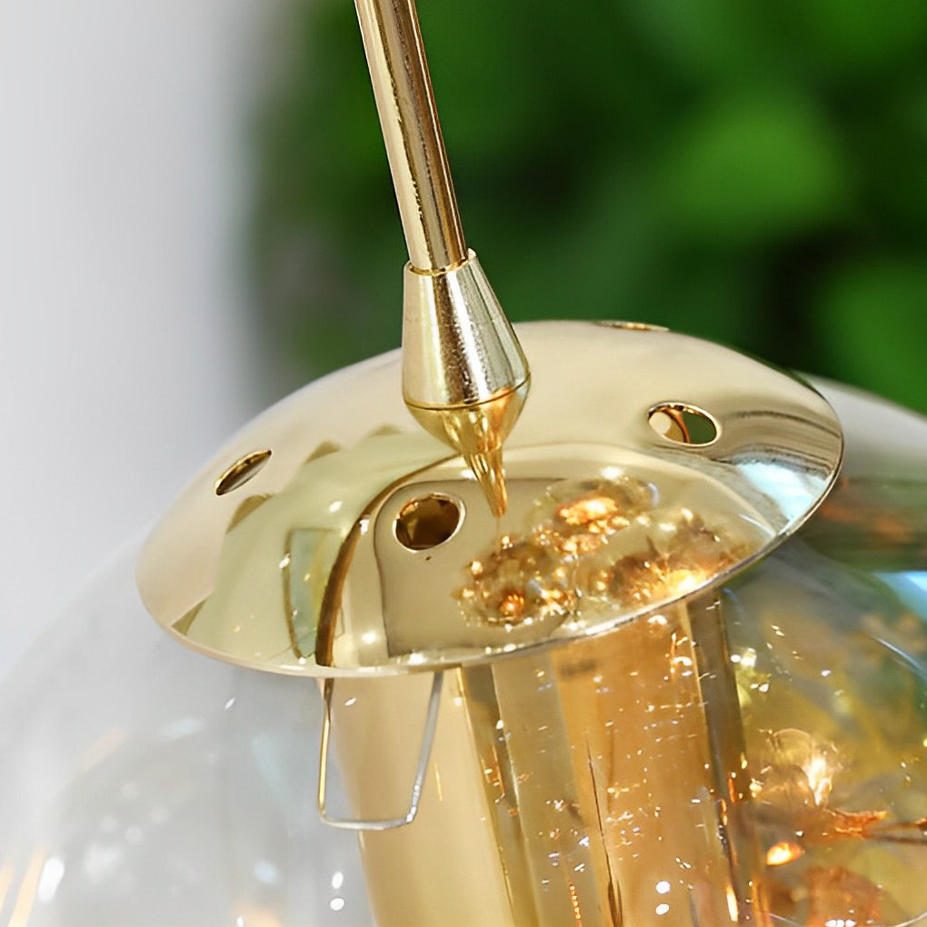 Gold staircase chandelier with a sleek design, enhancing a modern interior staircase.