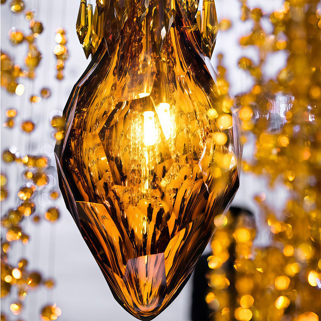 Gold pendant stairway chandelier lighting used above bedside in modern bedroom.
