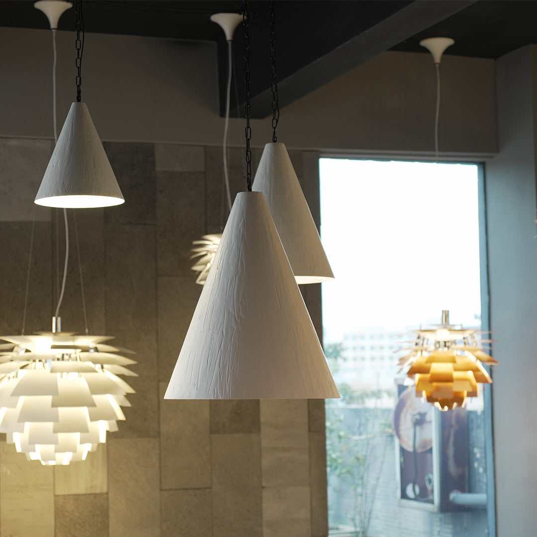 Nordic style pendant light with gray matte shade in contemporary living space.