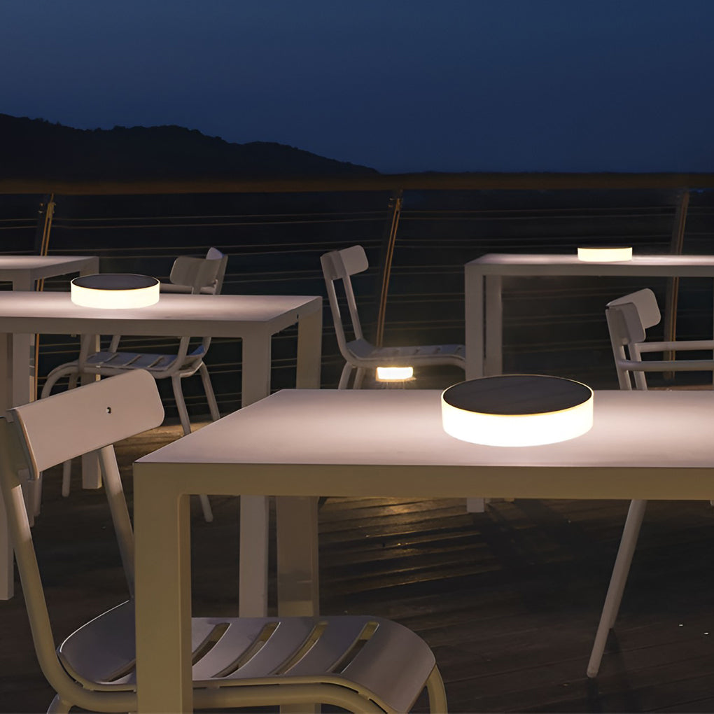 Ground solar lights enhancing a stylish outdoor fence with ambient light.