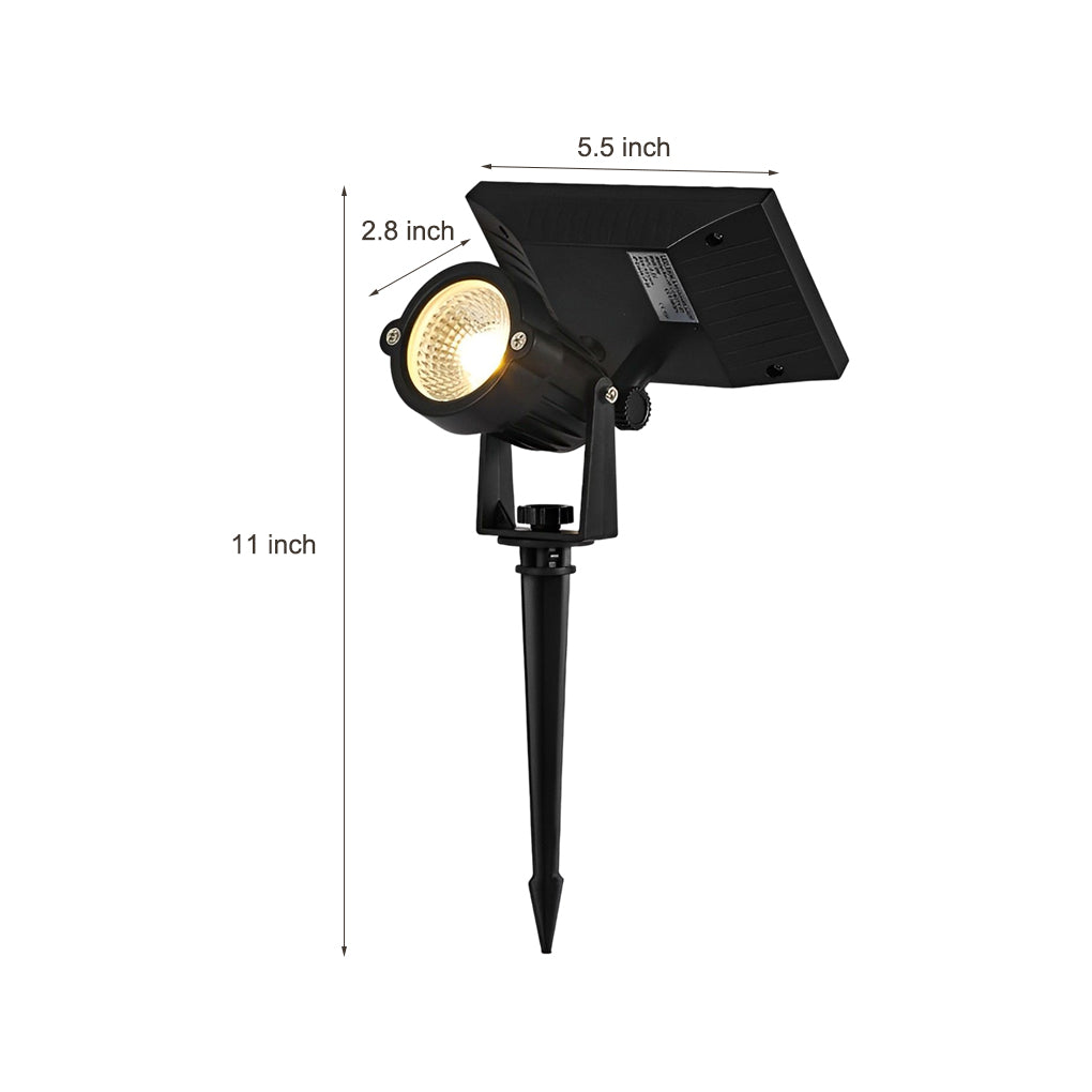 Ground spike solar lights installed in soil, demonstrating easy stake mounting for outdoor landscape lighting.