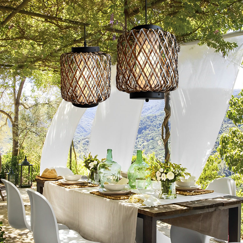 Hanging lantern lamp with intricate design in garden setting.