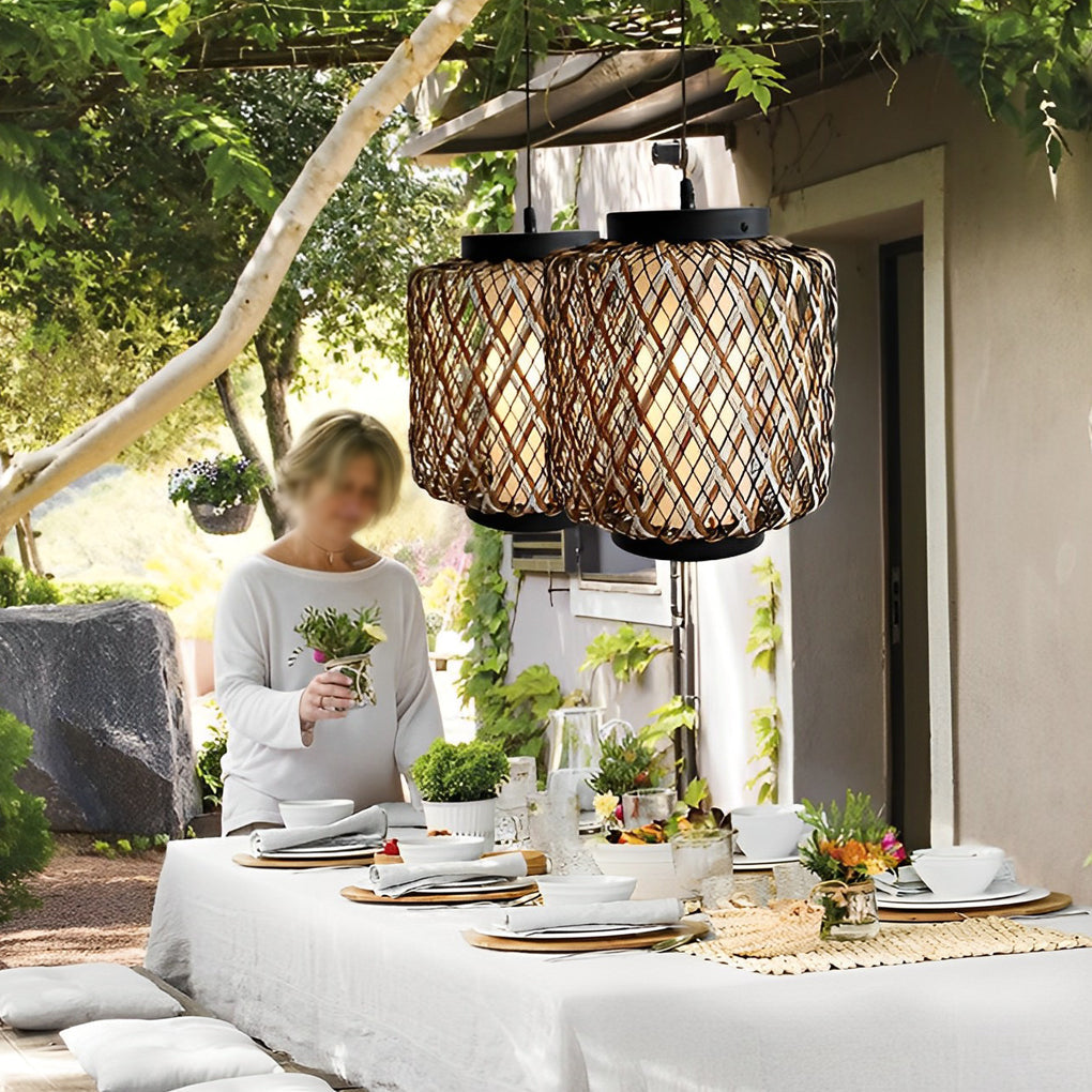 Hanging lantern lamp with woven design under pergola.
