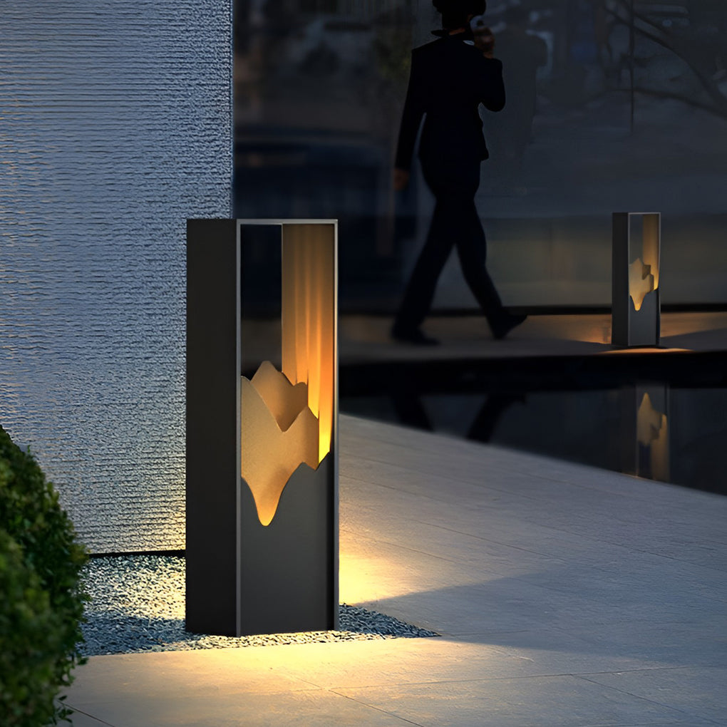Hollow lawn lamp enhancing a modern outdoor seating area with soft light.