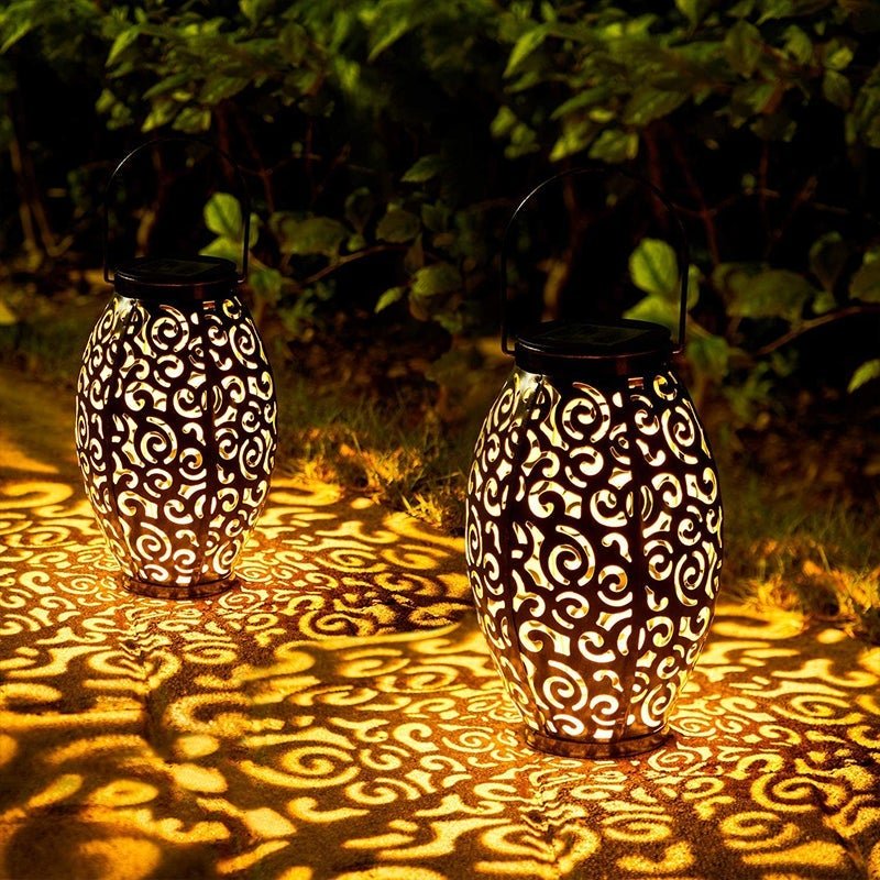 Hollow outdoor solar lights enhancing a cozy garden corner with decorative patterns.