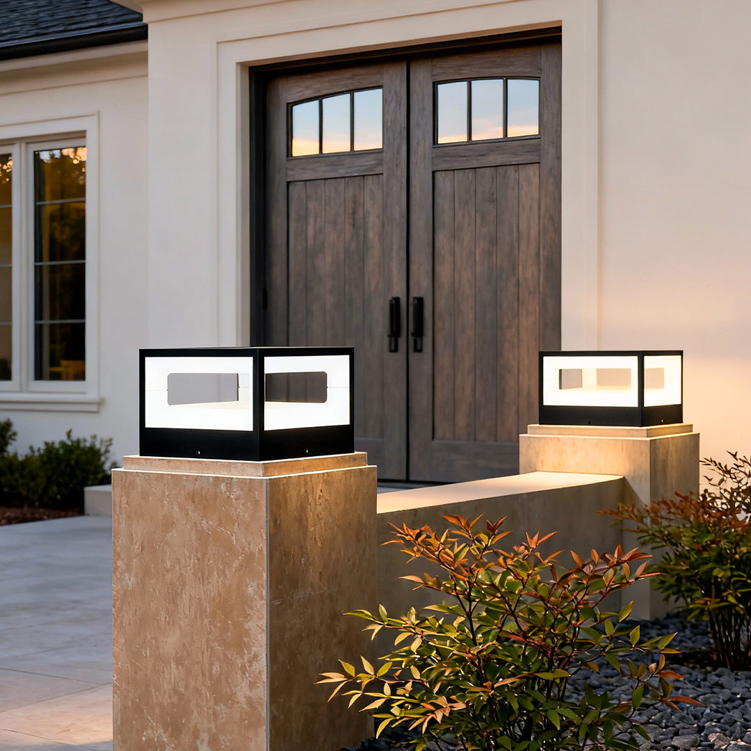 Hollow square pillar light installed at a house entrance, providing modern and warm illumination.