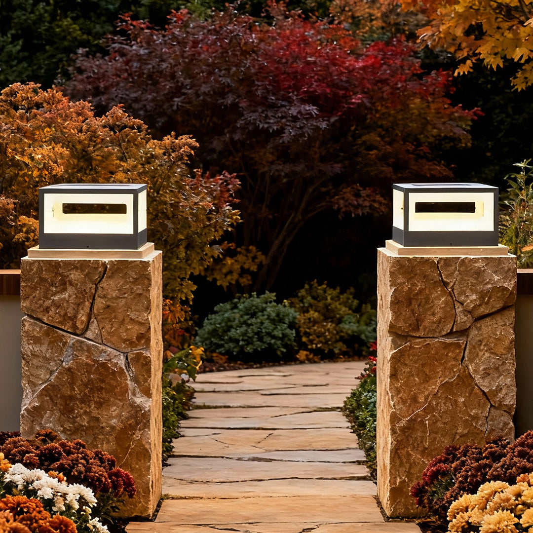 Hollow square pillar light on a stone pillar, enhancing the outdoor landscape with contemporary lighting.
