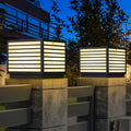 Home pillar light installed on outdoor gate posts at night