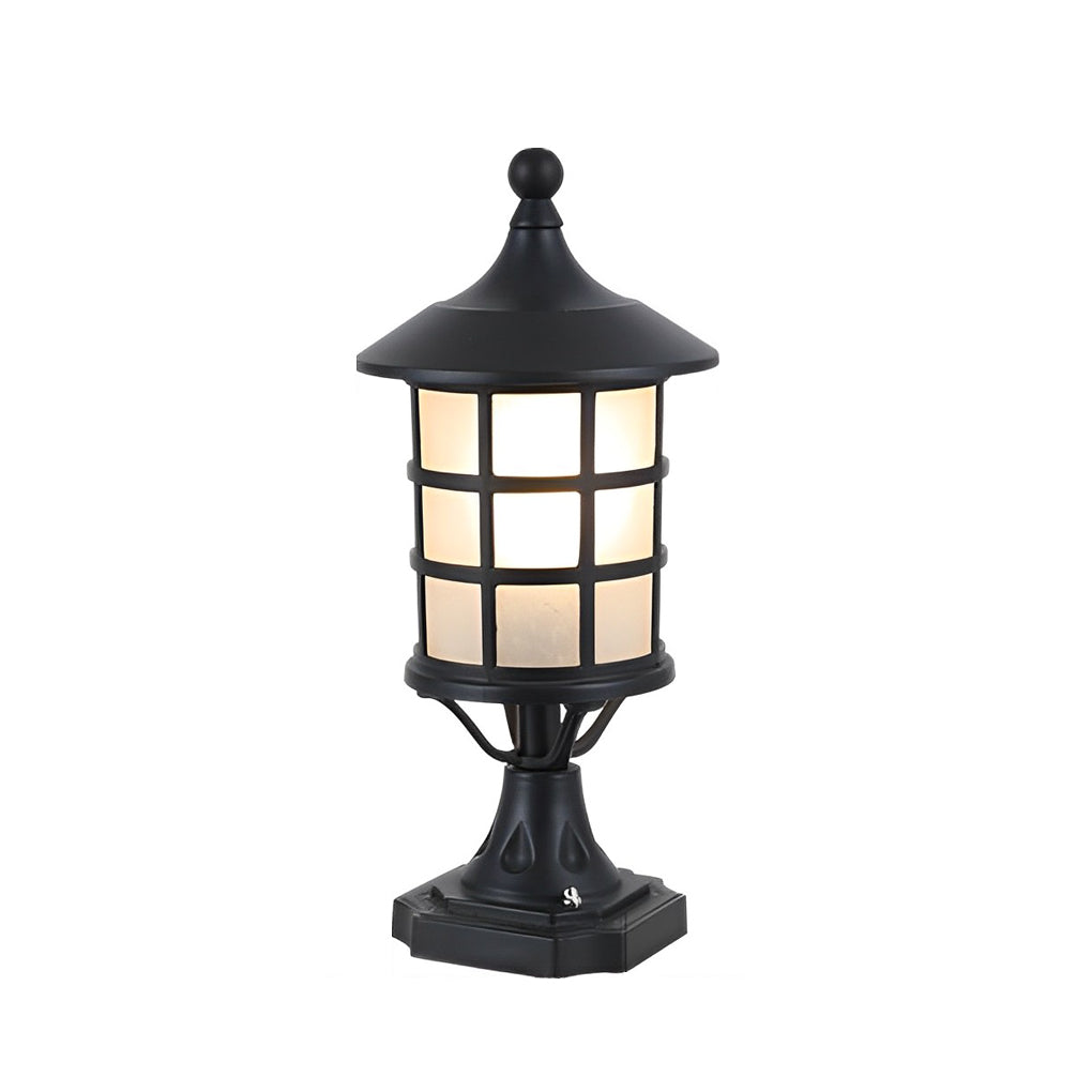 House pillar lights with a modern design, providing warm illumination in a backyard.