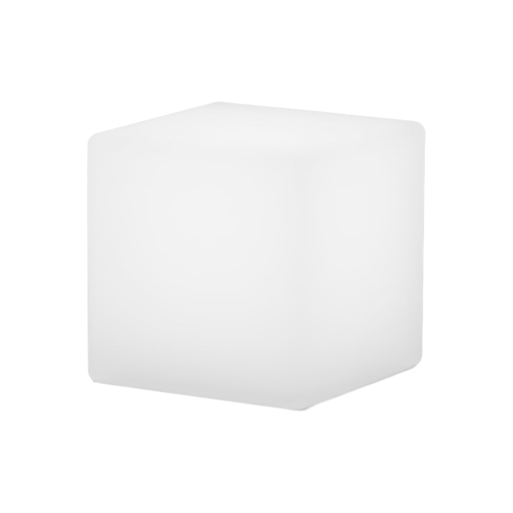 Ice cube LED lights with a minimalist design, glowing softly in an outdoor setting.