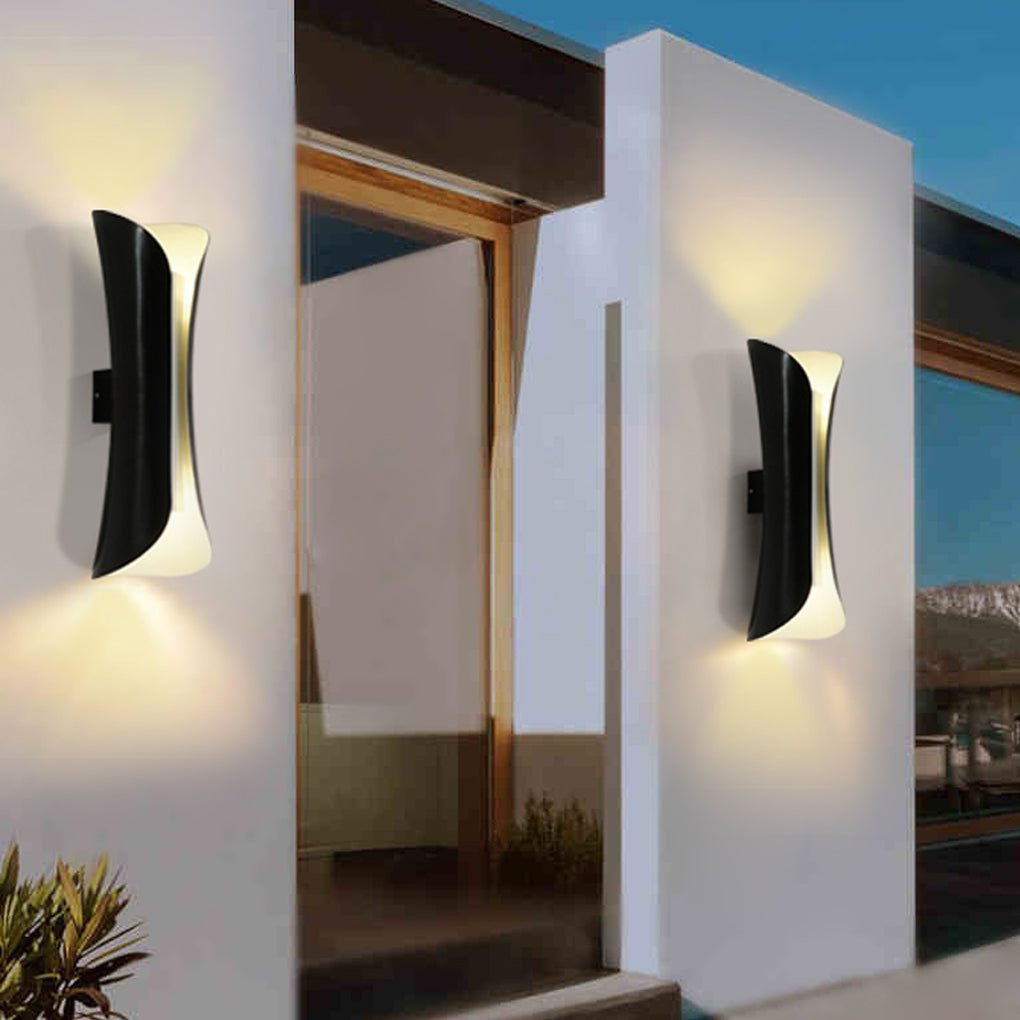 Indoor up down wall lights installed on exterior-facing wall near balcony entrance.