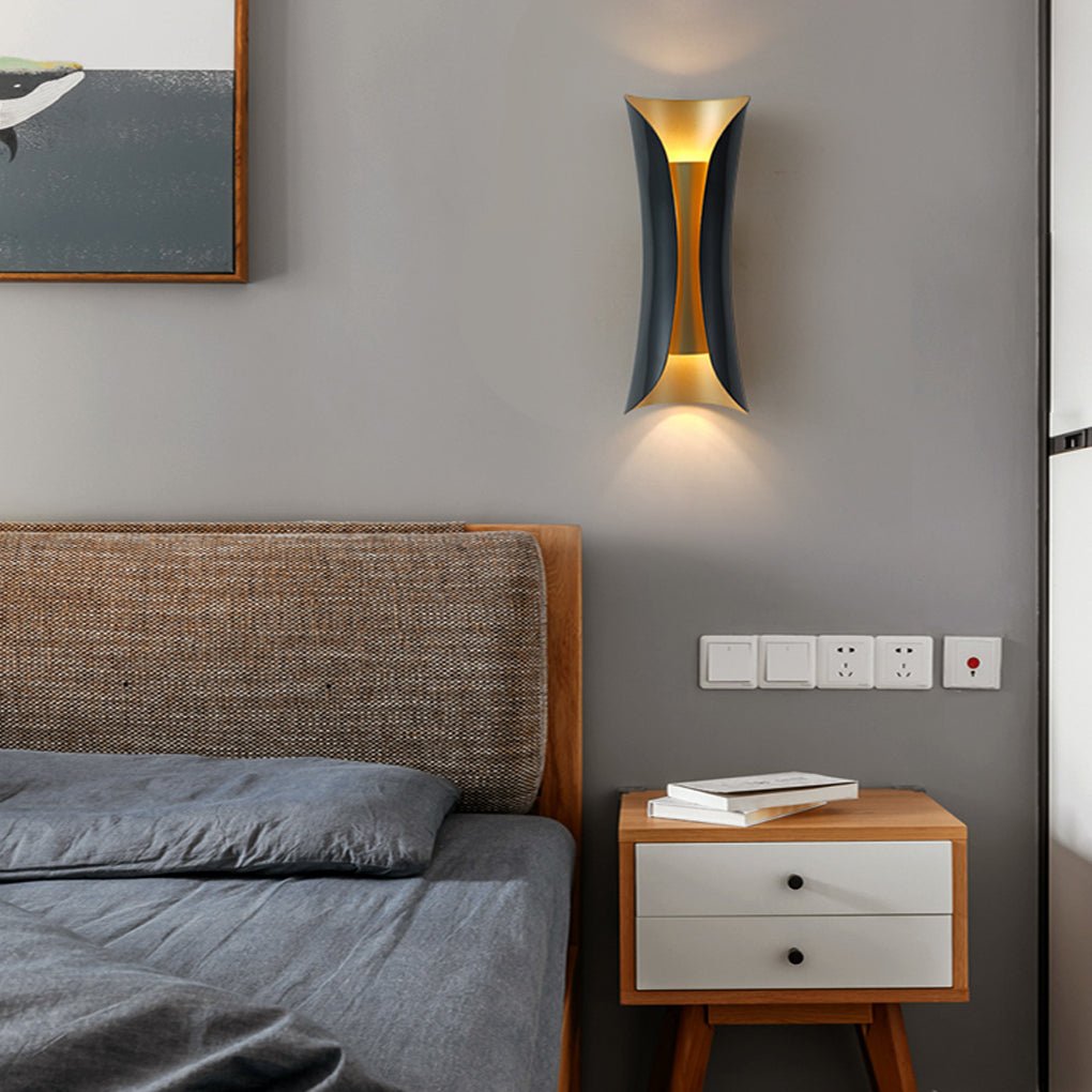 Indoor up down wall lights installed beside a modern bedroom bed with warm ambient lighting.