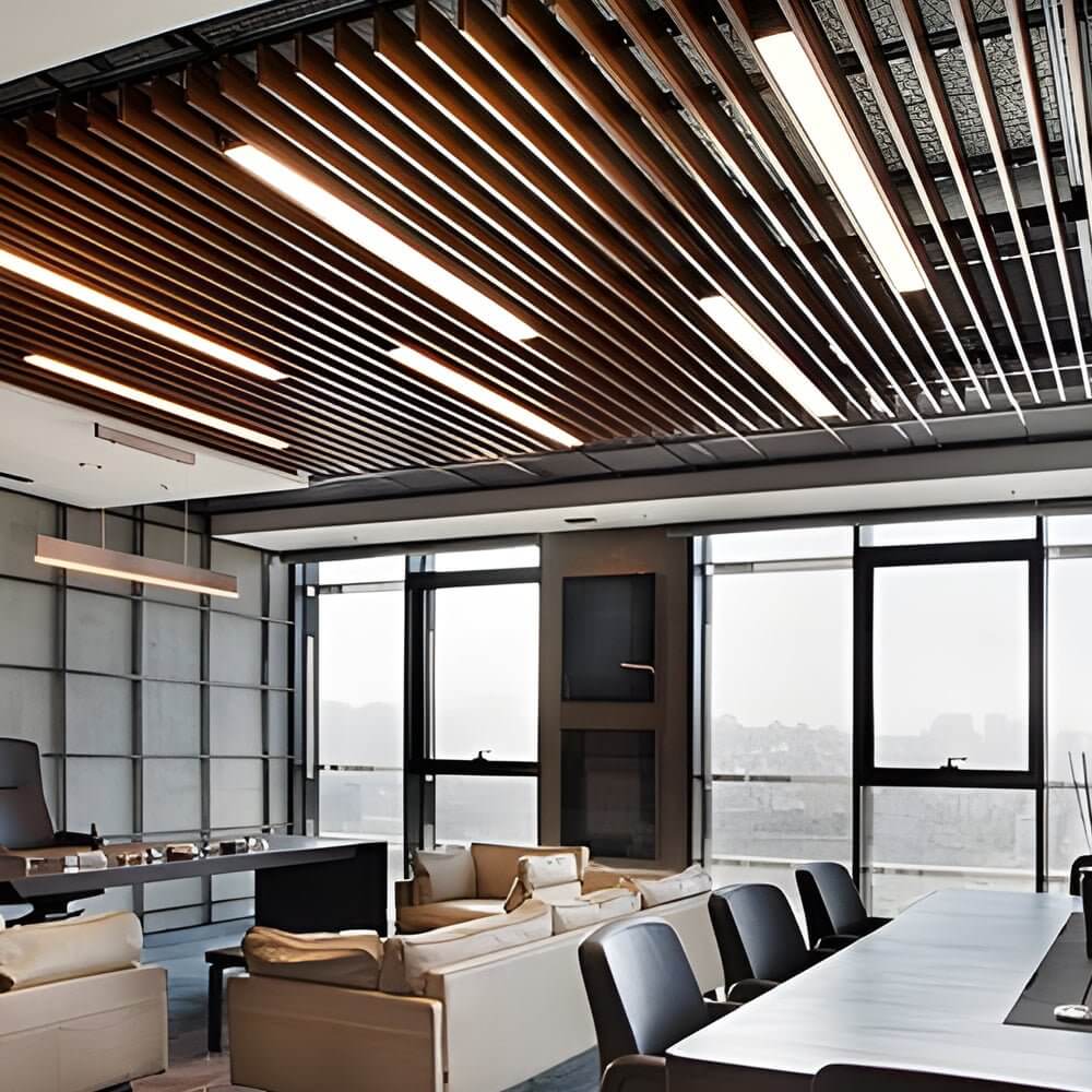 Industrial linear lighting in a contemporary office space with wooden decor.