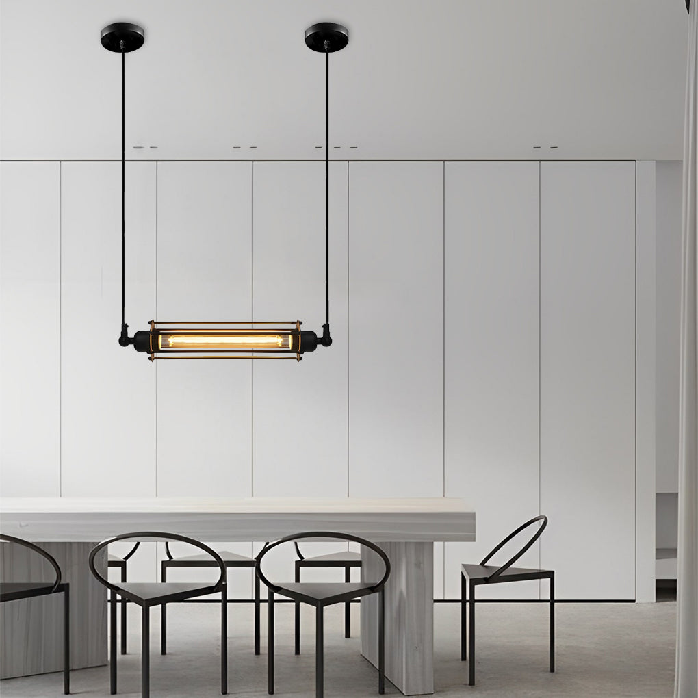 Industrial style pendant light fixtures with slim linear form hanging over a white dining table in a clean modern interior.