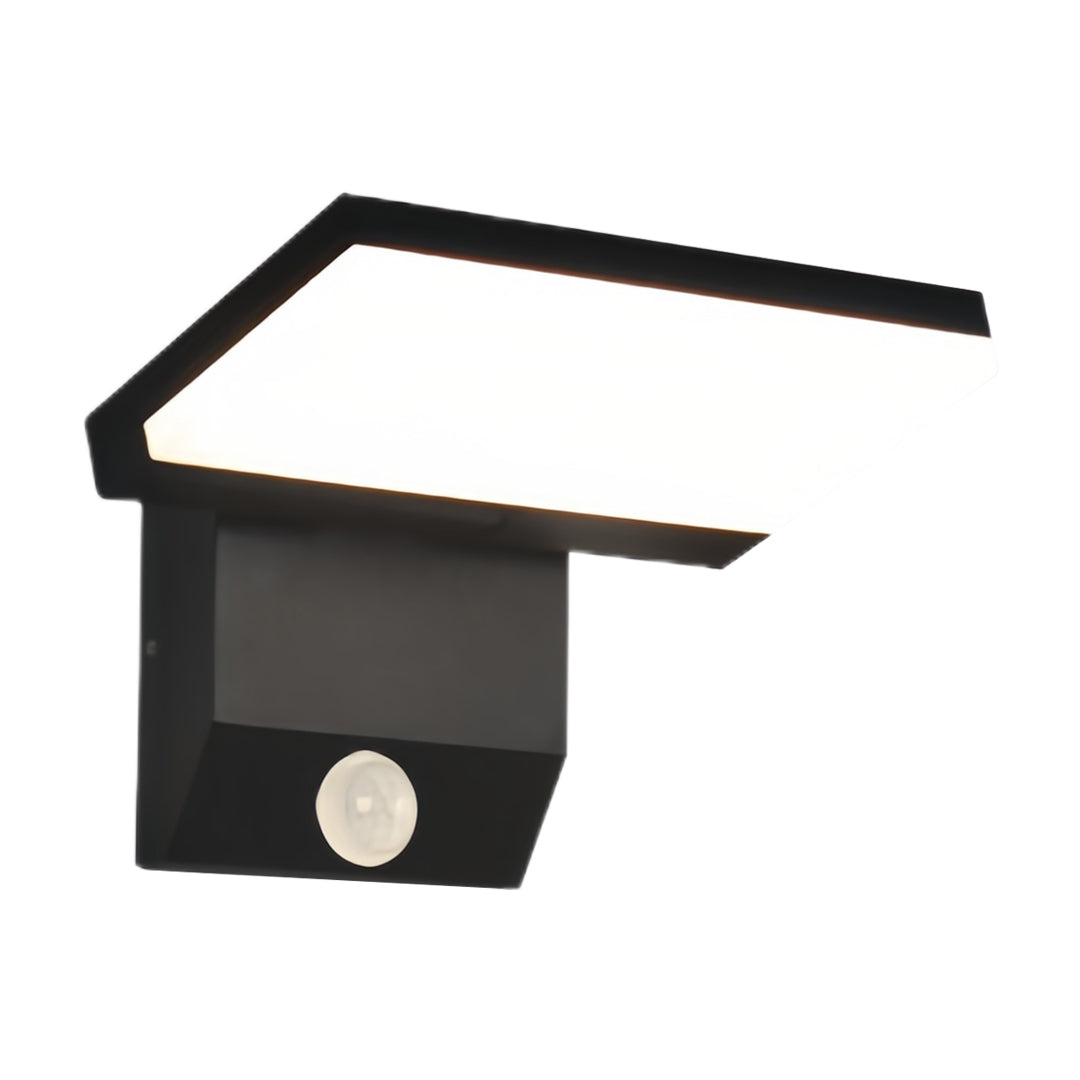 Industrial wall light with black housing and motion sensor for enhanced security lighting
