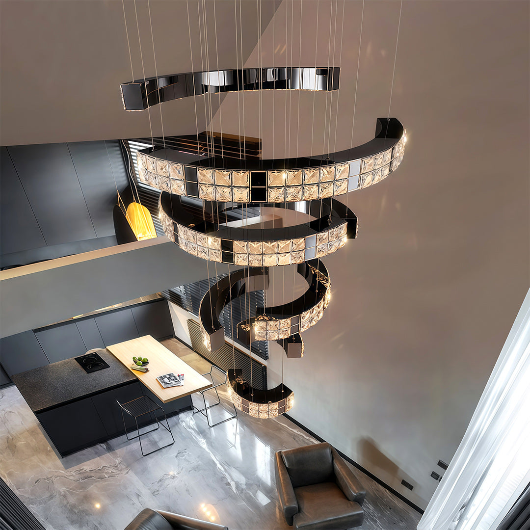 K9 crystal chandelier lighting up a modern hallway with high ceiling.