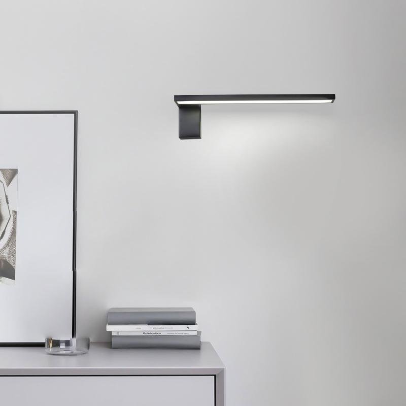 L shape wall light installed above cabinet with focused downward light.