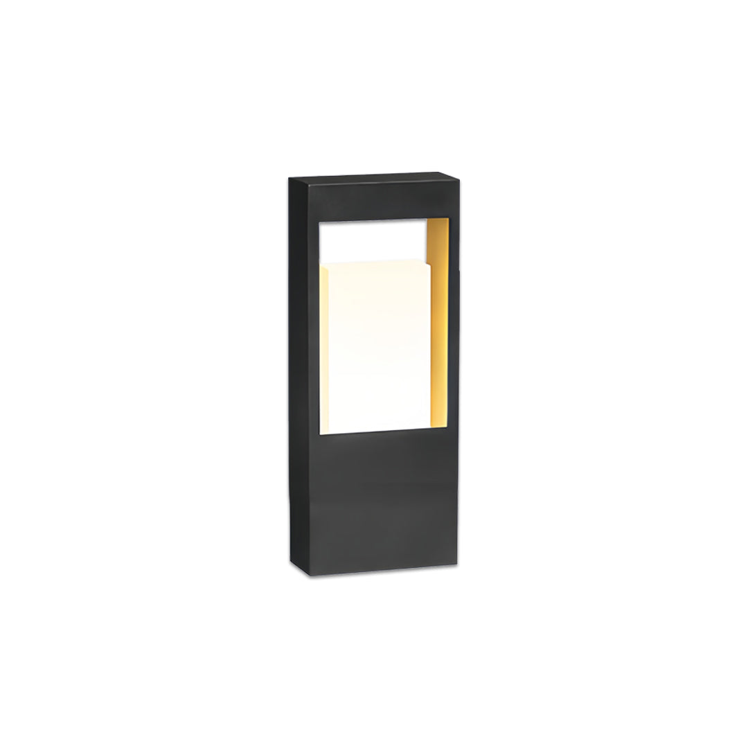 Contemporary landscape bollard lighting featuring a tall black rectangular housing with soft warm illumination.