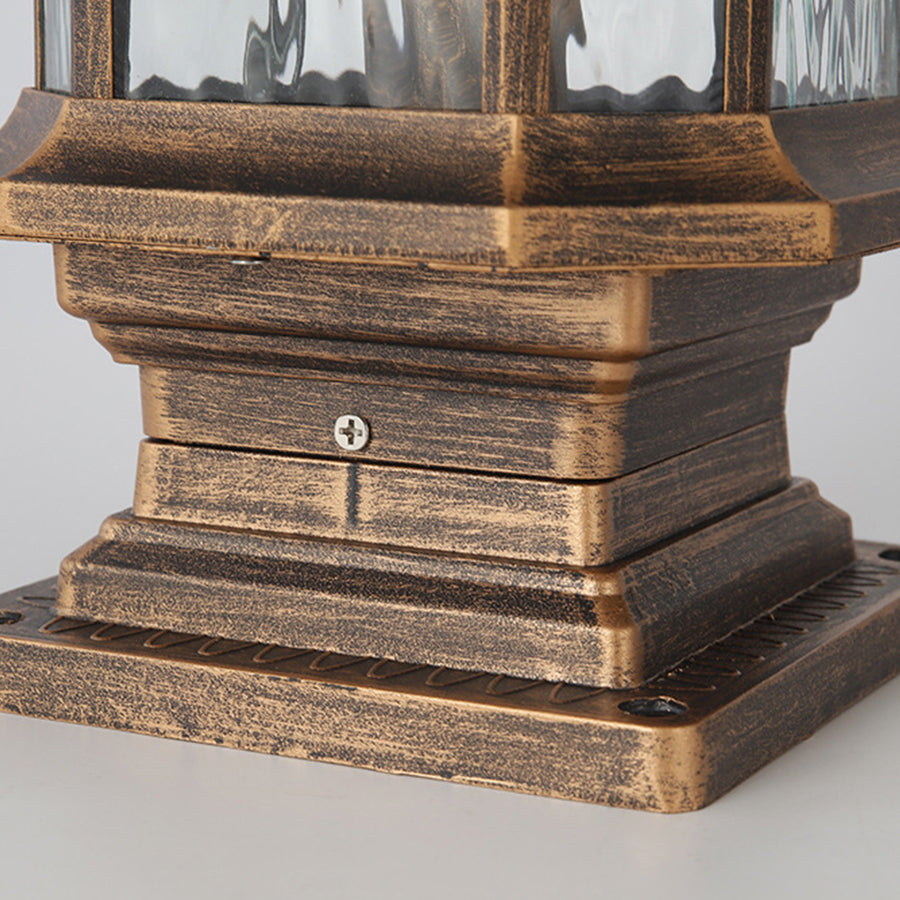 Lantern pillar lights with a bronze finish, adding a vintage touch to outdoor pathways.