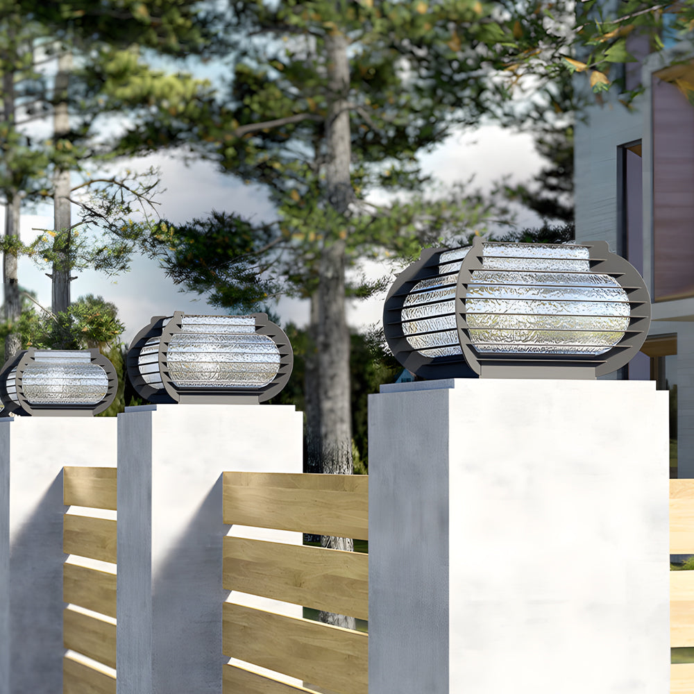 Contemporary lantern pillar lights displayed on concrete columns, ideal for driveways and landscape entrances.