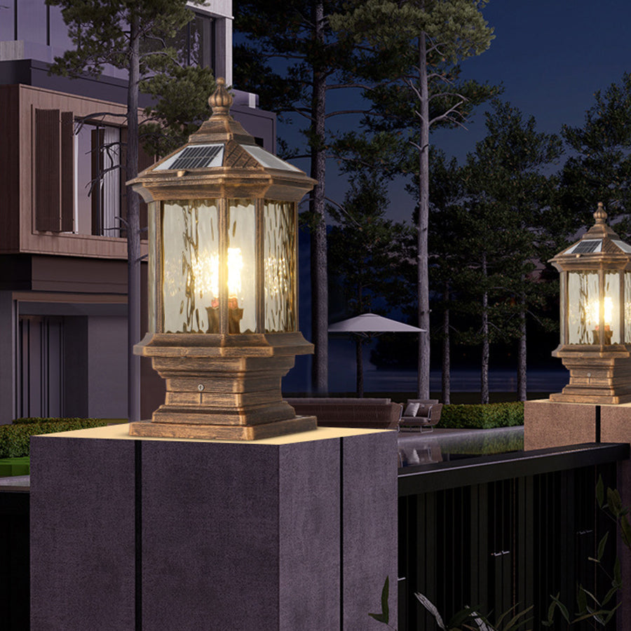 Lantern pillar lights by a poolside, enhancing the evening atmosphere with soft illumination.