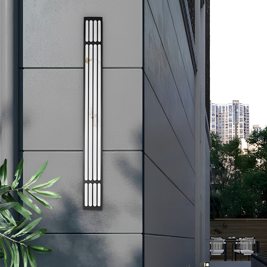 Large outdoor wall light enhancing a garden pathway with warm, ambient glow.